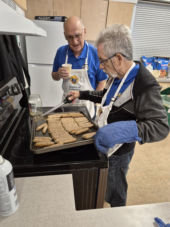 Prepping sausages in the school kitchen