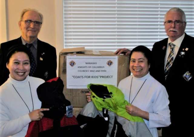 Nanaimo Knights of Columbus Councils 3842 and 9990 presenting the Coats for Kids donation box to the Sisters
