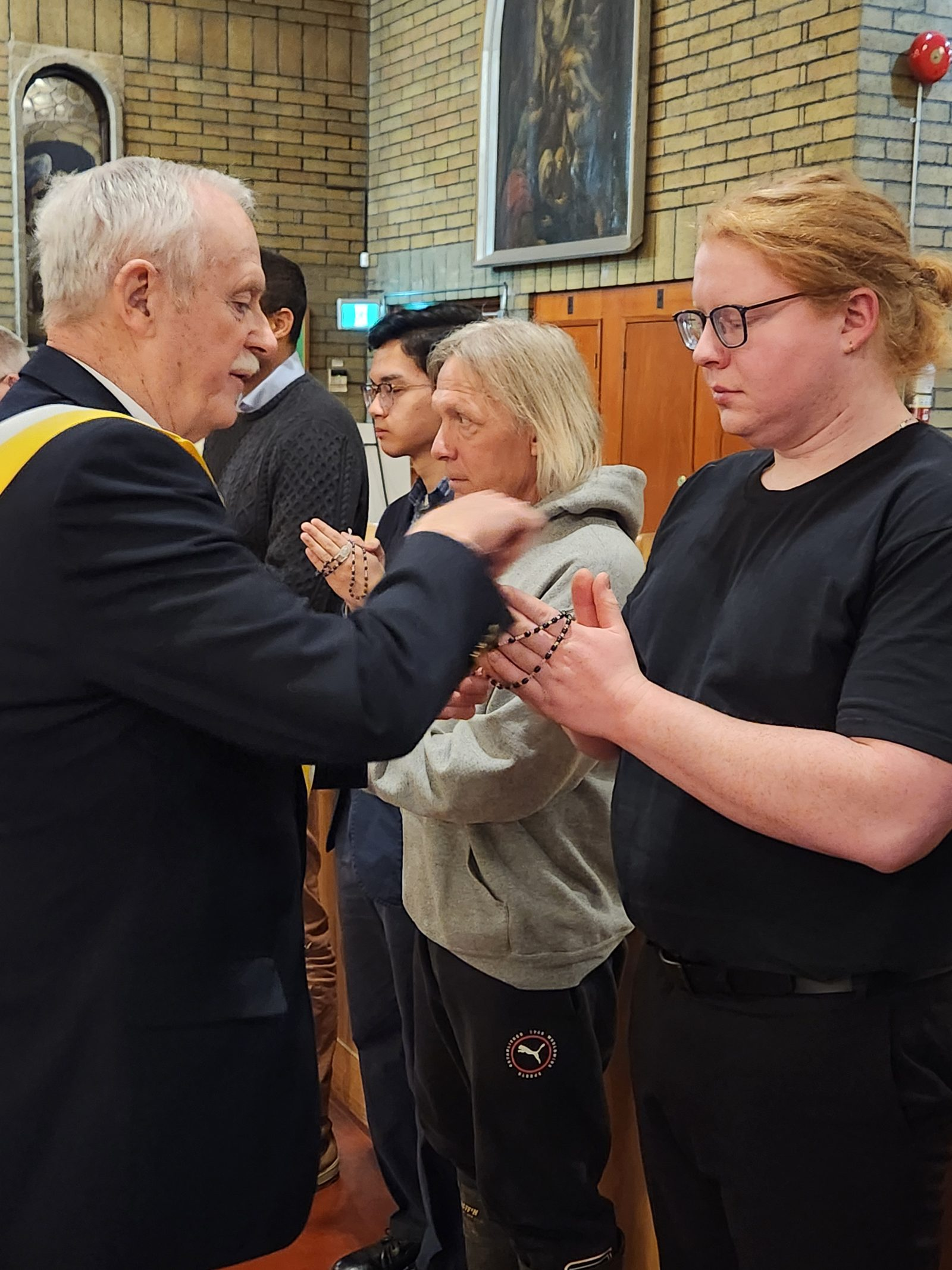 A Brother Knight receives his rosary during the Exemplification