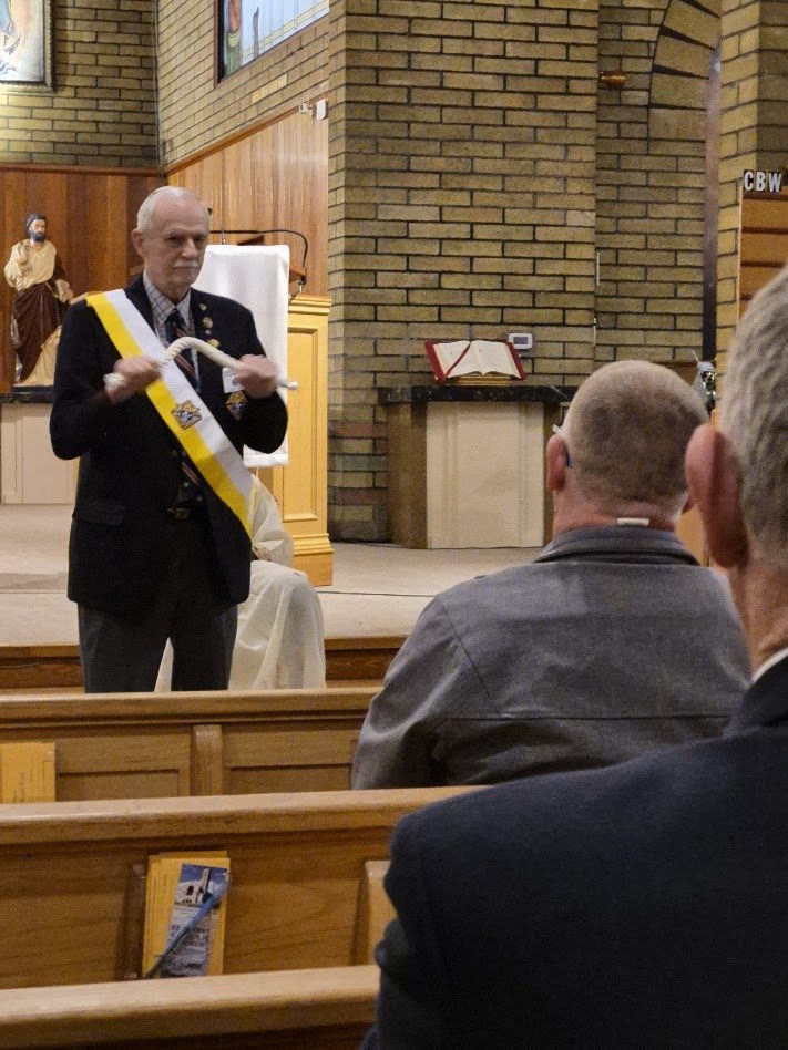 Preparing the ceremonial sash before the Exemplification