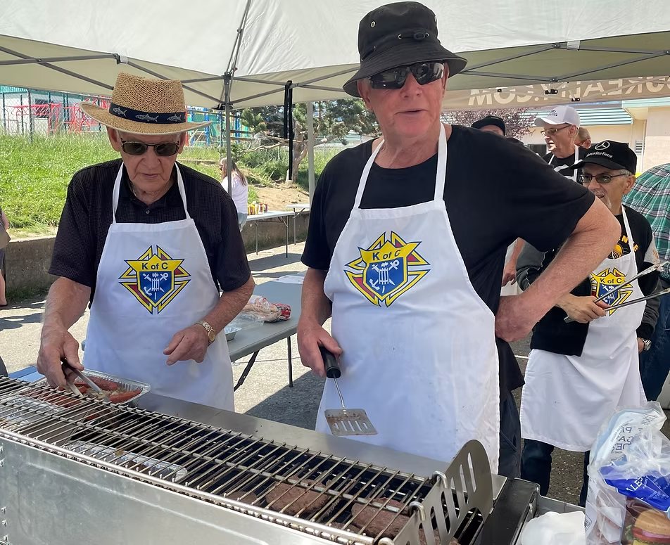 Grilling hot dogs at Fun Day