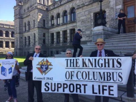 Knights of Columbus Council 3842 members with a Support Life banner at the BC Legislature